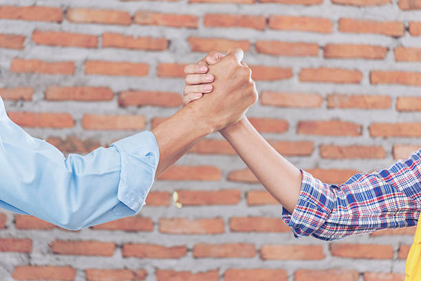 Teamwork concept, putting their hands together