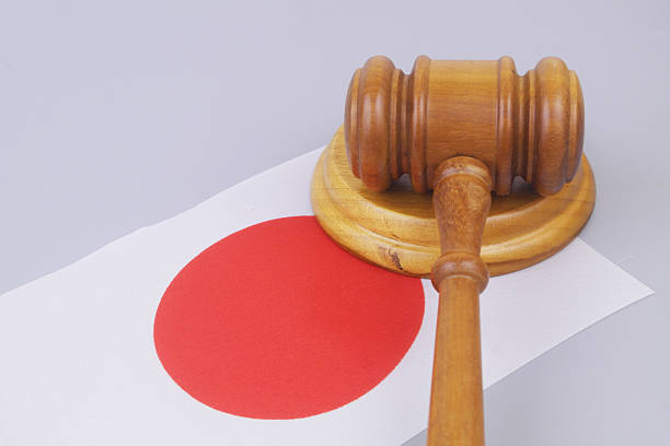 Judge gavel on flag of Japan. Laws and court in Japan concept.
