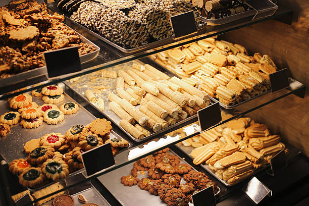 Fresh baked desserts in shop showcase. Confectionery selection for customers.