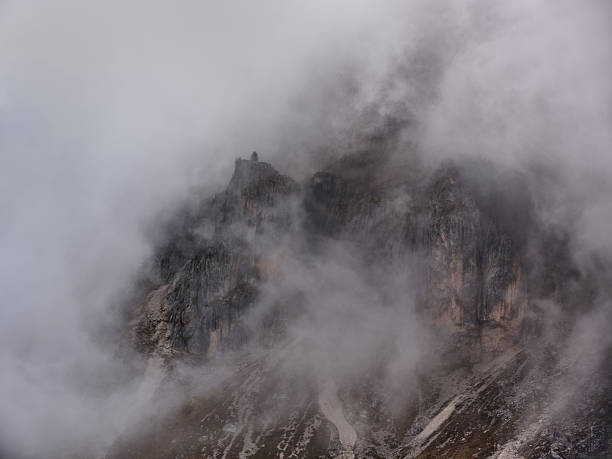 View of the Monte Antelao mountain through dramatic clouds in Dolomites, Italy. Photographed in medium format.