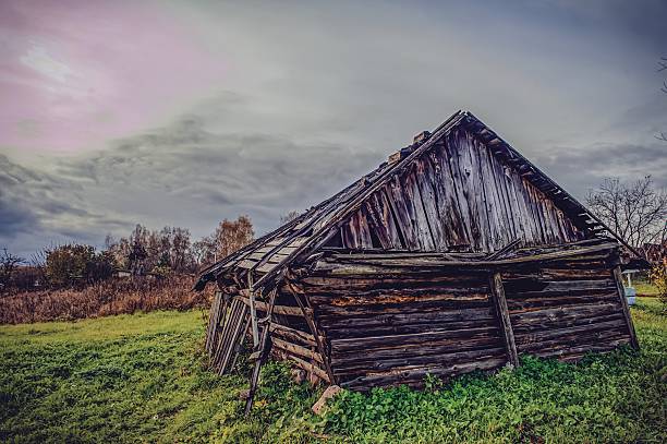 an old dilapidated barn in a village, Russia