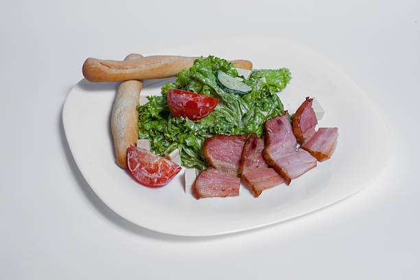 A delicious salad filled with crunch and color is being enjoyed for lunch.