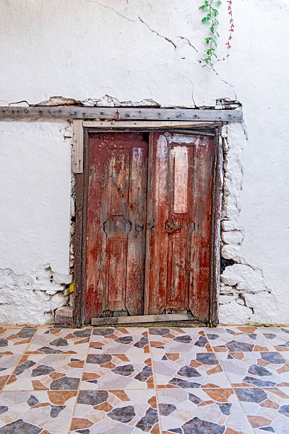 A retro view of a historic house's door and floor.