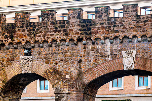 Detail of stone-and-brick archway of the Passetto di Borgo fortified passage, Rome, Italy.