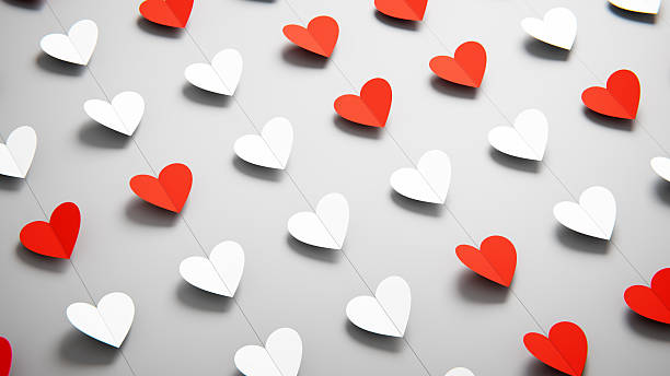 Red and white folded paper hearts garland for soft Valentine's Day.
