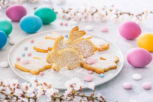 Easter bunny almond cookies and Easter eggs on decorated festive table