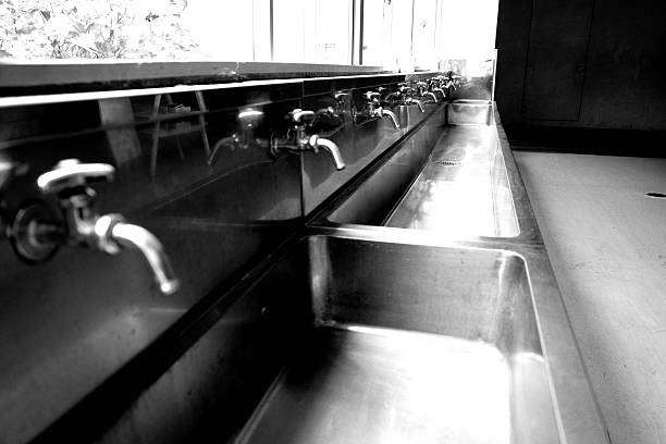 Aluminum sink and faucet. Dark.