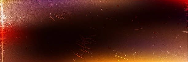 istock Old film light leaks and scratches create a textured background. Dust and grain give a vintage feel, while a rainbow lens flare adds color and warmth to the scene. 2260692520