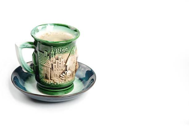 Fluffy coffee mug on brown and soft balloon surface.