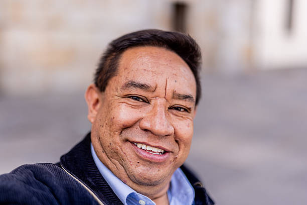 Mature man taking a selfie or filming outdoors - camera point of view