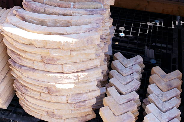 Stacks of new red bricks for sale at a home improvement store.