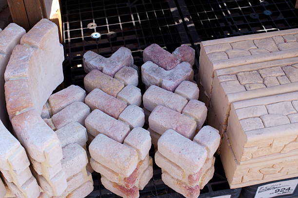 A pile of new bricks at construction site sitting on wooden flat. We have other construction images in our portfolio.