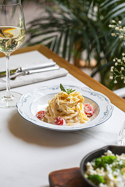 Creamy pasta with cherry tomatoes and herbs