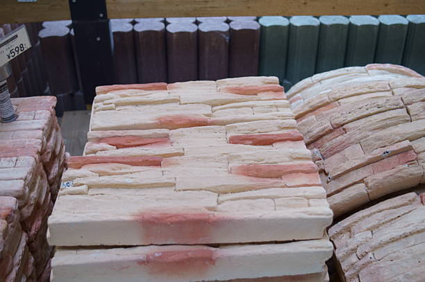 Stacks of new red bricks for sale at a home improvement store.
