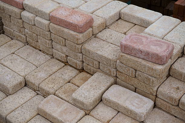 Stacks of new red bricks for sale at a home improvement store.