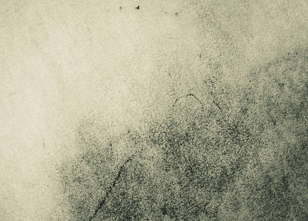 Abstract graphite texture with warm beige and gray tones, showing soft pencil shading and organic grain. Versatile artistic background suitable for print, web, and contemporary design projects.