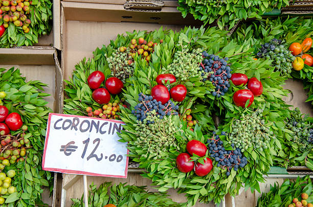 During the fall one can find beautiful coroncine of fruits and vegetables at the market stalls in Bolzano, South Tyrol, Italy.