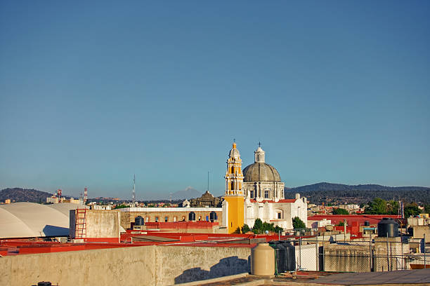 Yellow Colonial Church Dome and Bell Tower with Distant Volcano View