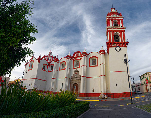 White and Red Colonial Church Facade with Tall Bell Tower
