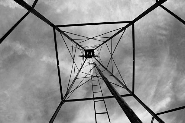 Old water tower with new towers taking its place