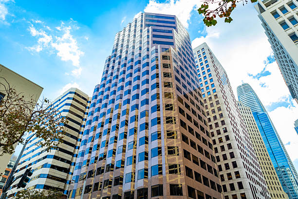 Glass and steel office towers rise above the streets of the bustling Financial District in downtown San Francisco