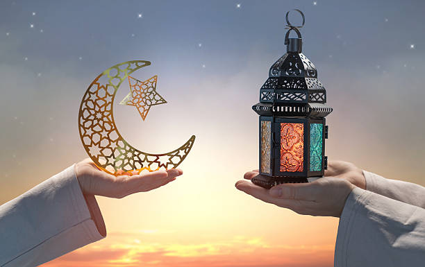 istock Ramadan Kareem Greeting with Crescent Moon and Traditional Lantern at Sunset 2260812165