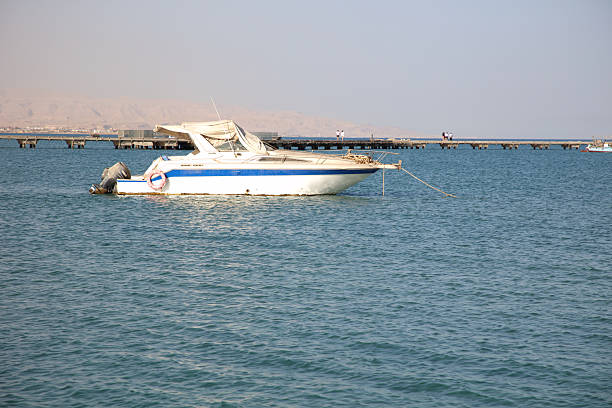 Boats, Hill, Peer and the Red Sea