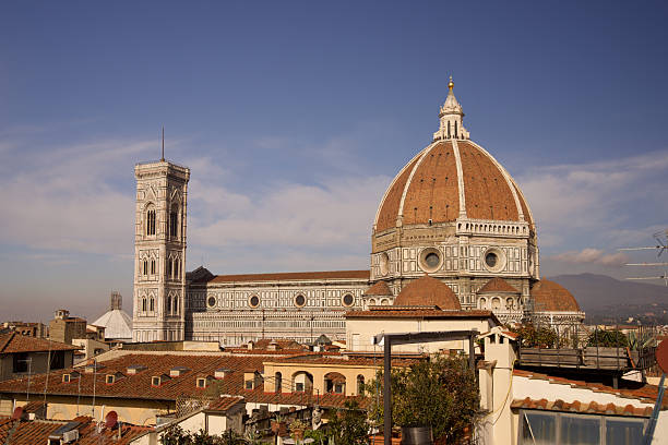 The Florence Cathedral, officially the Cathedral of Santa Maria del Fiore, is the iconic symbol of Florence and a UNESCO World Heritage Site . Construction began in 1296, and its most revolutionary feature is the colossal dome designed by Filippo Brunelleschi and built between 1420 and 1436 . It was the world's largest masonry dome at the time, constructed without external scaffolding using innovative techniques like a double-shell structure and herringbone brick pattern . The interior of the dome is decorated with a magnificent fresco of \