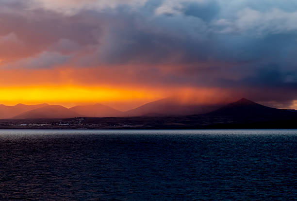 Sunset and amazing cloudscape over distant mountains, Fuerteventura, Atlantic Islands, Spain, Europe..