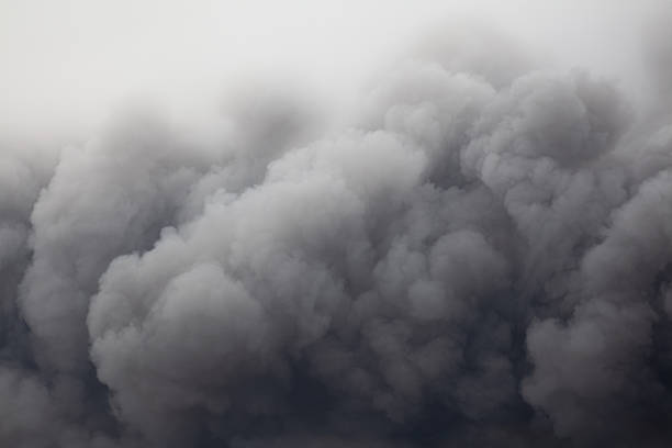 Fire, clouds of smoke against the sky, environmental disaster