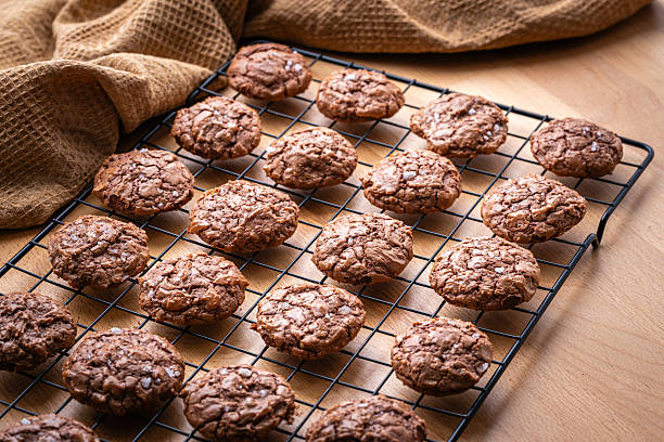 Sweet food: homemade chocolate cookies with salt flakes on cooling rack