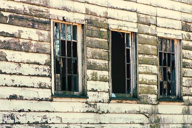 The facade of old deserted house on. the island of Bornholm. Denmark.  The house holds a history of lived lives - but has now been demolished.