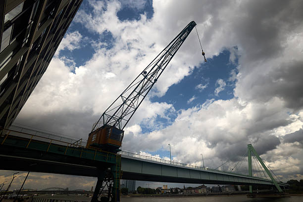 Low angle view of Severinsbruck bridge and dock crane in Cologne, Germany.