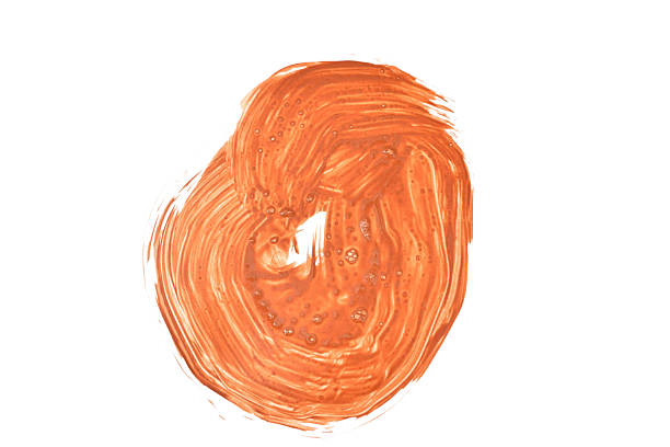 Orange watercolor paint spot isolated on white background.