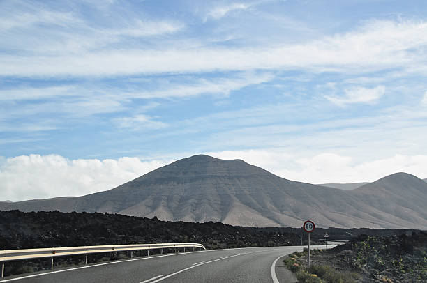 Empty road in volcanic landscape of Lanzarote