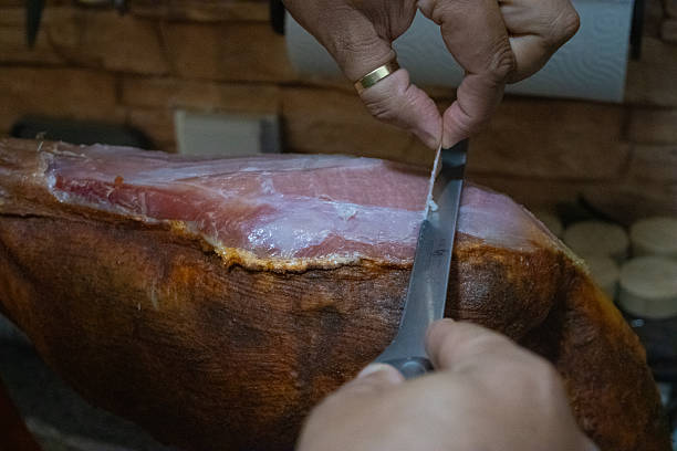 Cutting thinly-sliced Portuguese parma ham