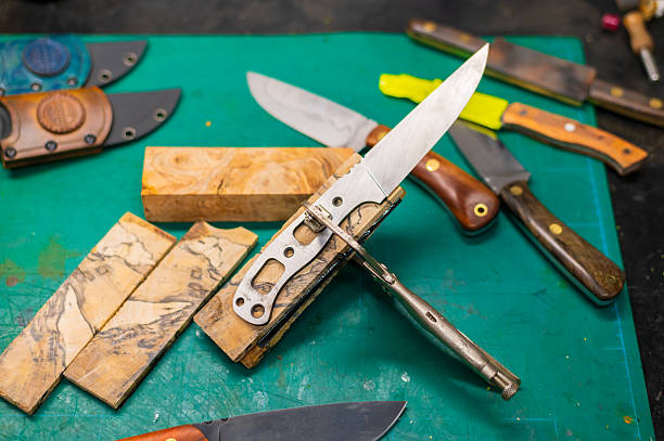 Bushcraft knife plunged into a tree stump amidst vibrant forest moss and plants