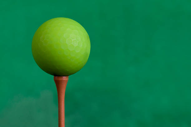 Golf Ball on Tee background close up.
