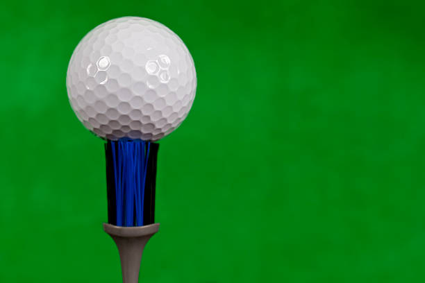 club,golf ball,tee and grass on white background