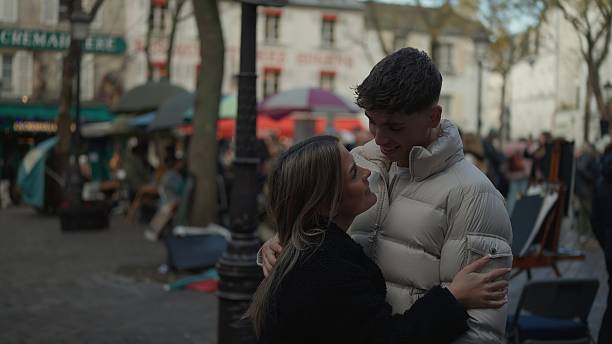 Young couple embracing and looking at each other in Montmartre, Paris