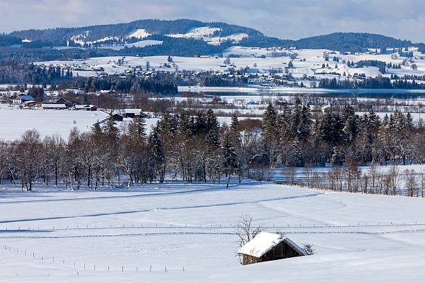 A beautiful, winter, snow-covered landscape with mountains in European Alps in  Schwangau, Allgau, Bavaria, Germany.