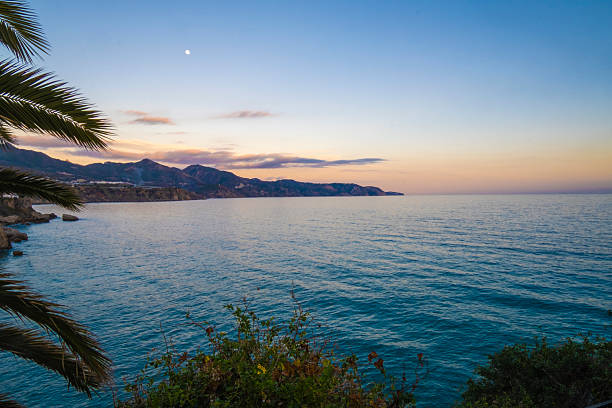 Palm Framed Sunset Moon Sea Nerja Coastline.