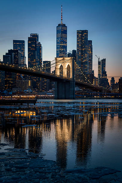 The Brooklyn Bridge and Manhattan, shot from Brooklyn during a bomb cyclone and single digit temperatures. Ice is seen in the East River.