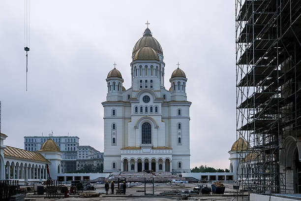 Bucharest, Romania – View of the National Cathedral of Romania, featuring monumental Orthodox architecture with golden domes and ongoing construction elements.