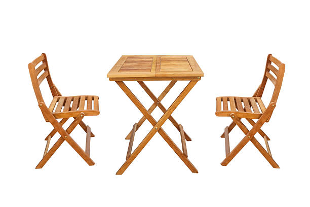wooden table and chairs isolated on a white background
