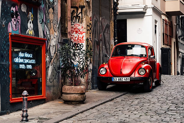 A highly stylized panning shot capturing a red car in motion, with intense motion blur and vibrant colors evoking speed, energy, and dynamic movement. The abstract nature of the image makes it ideal for use in automotive campaigns, motion-based design projects, backgrounds, technology themes, or as conceptual art symbolizing acceleration, urgency, and the fast pace of modern life.
