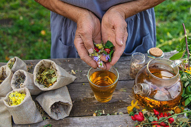istock Medicinal herbs and tea old woman. Selective focus. 2261016496
