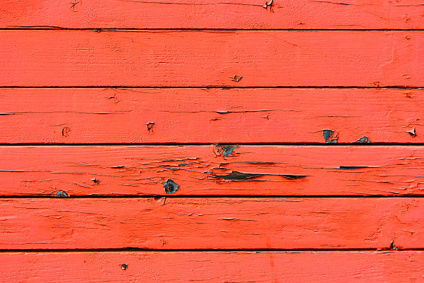 Peeling Red Paint on Weathered Wooden Planks