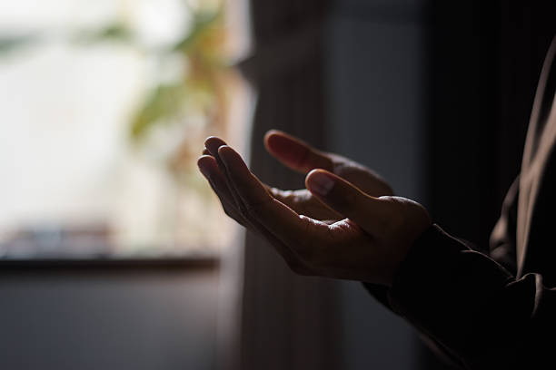 Child's delicate fingertips gripping the edge of a table during a tempter tantrum. Can showcase child behavior or symbolize childhood curiosity, growth, willpower, and the desire to reach new heights.