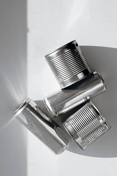 Top view of aluminum cans on white background, clean composition, recycling, and metal concept.